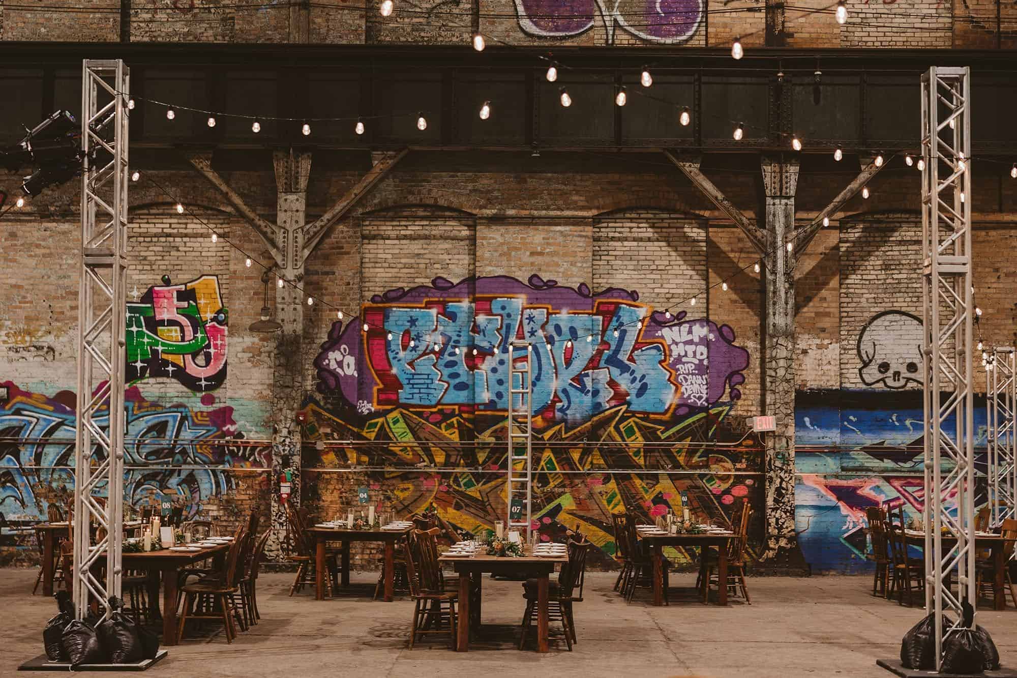 Atmospheric industrial bistro lighting installation by ILLUME at the historic Carrie Blast Furnaces in Pittsburgh, PA.