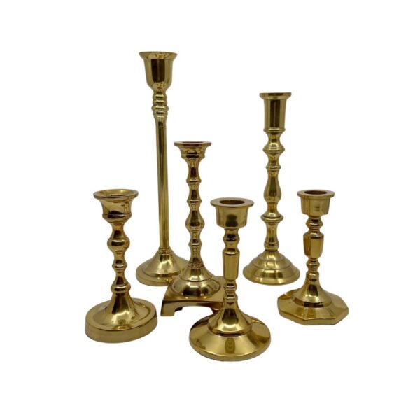 Gold mismatched taper candle holder rental by ILLUME