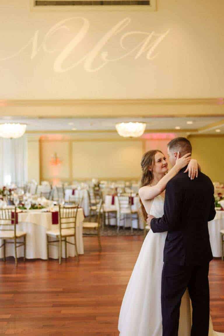 Custom wedding monogram lighting and romantic dance floor illumination by ILLUME for a couple's first dance in Pittsburgh, PA.