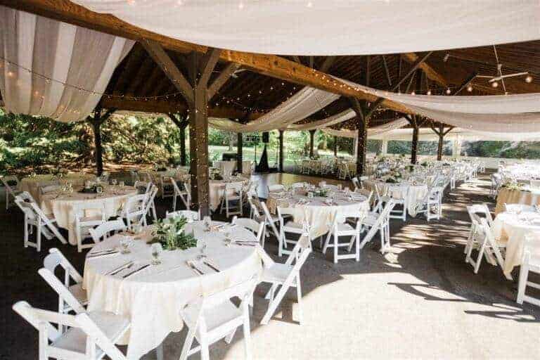 Elegant ivory pavilion draping by ILLUME for a nature-inspired wedding at Succop Nature Park in Butler, PA.