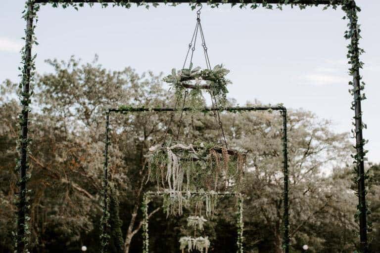 Custom floral chandelier installation by ILLUME for a luxury mansion wedding at Linden Hall in Dawson, PA.
